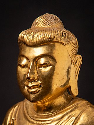Old gilded wooden Burmese Buddha statue