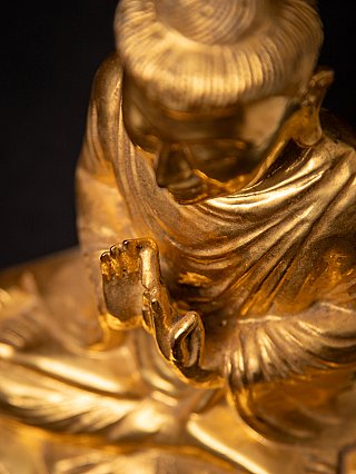Old gilded wooden Burmese Buddha statue