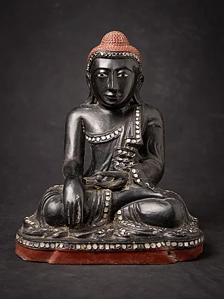 Old Burmese wooden Mandalay Buddha statue