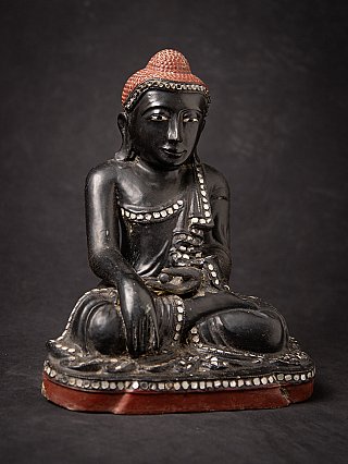 Old Burmese wooden Mandalay Buddha statue
