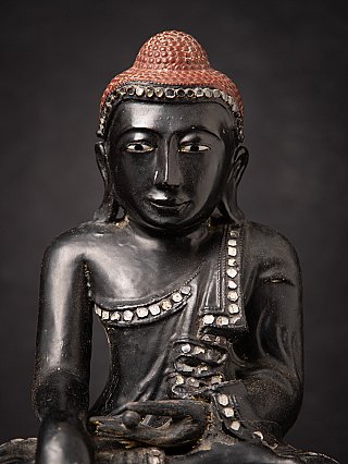 Old Burmese wooden Mandalay Buddha statue