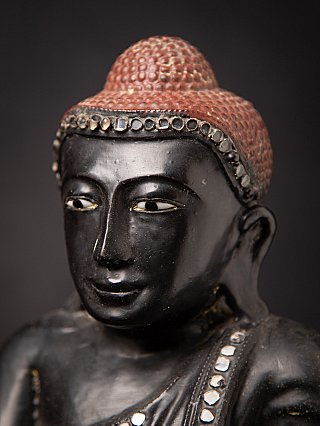 Old Burmese wooden Mandalay Buddha statue