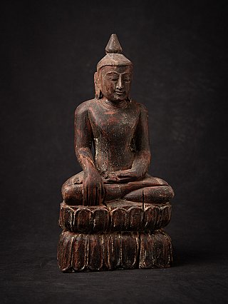 Old wooden Burmese Buddha statue