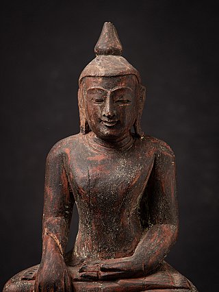 Old wooden Burmese Buddha statue