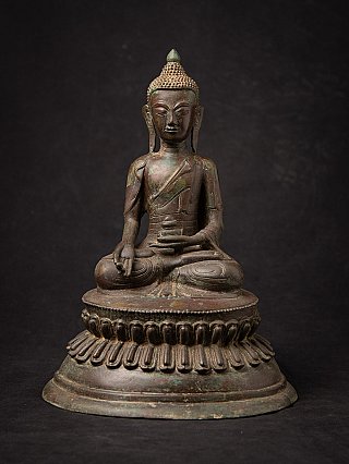 Burmese bronze Buddha statue seated in Varada mudra on lotus base, full front view