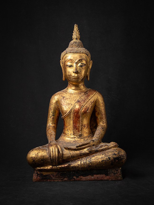 Thai Buddha statue in wood, seated in bhumisparsha mudra, full front view