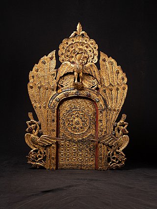 Antique Burmese wooden temple panel with gilded peacock and ornate shrine arch, front view