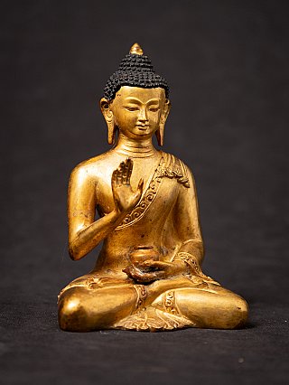 Old bronze Nepali Buddha statue