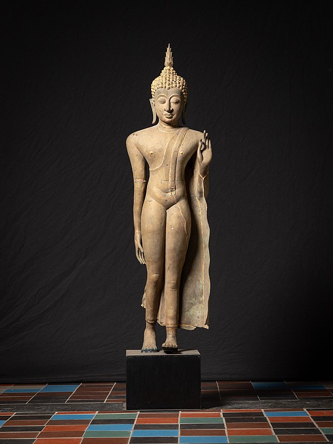 Thai Sukhothai Buddha statue in bronze, standing with vitarka mudra, full front view