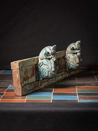 Antique Indian temple panel with two horse heads