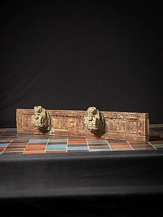 Antique temple panel from India with two horse heads
