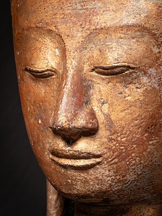 Extreme close-up of the Burmese Buddha head, focusing on nose and mouth