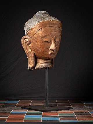 Burmese Buddha head, three-quarter right view with downcast eyes