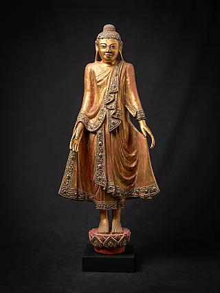 Antique wooden standing Mandalay Buddha statue