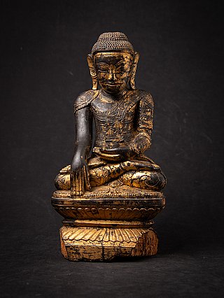 Burmese wooden Buddha statue seated in bhumisparsha mudra, full front view