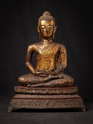 Thai bronze Buddha statue seated in dhyana mudra, full front view on tiered base