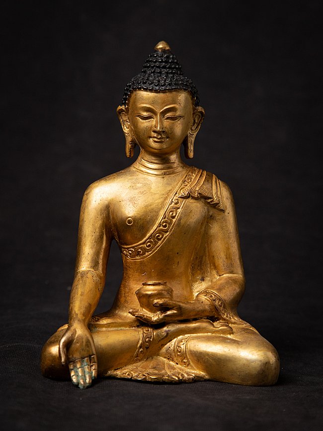 Old bronze Nepali Buddha statue