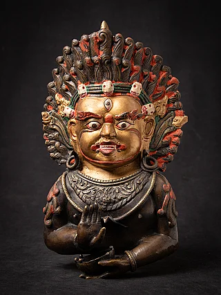 Antique bronze mask of Mahakala