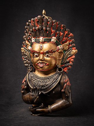 Antique bronze mask of Mahakala