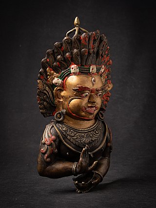 Antique bronze mask of Mahakala
