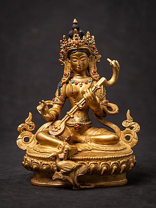Nepali bronze Saraswati statue seated with stringed instrument and jeweled crown, front view