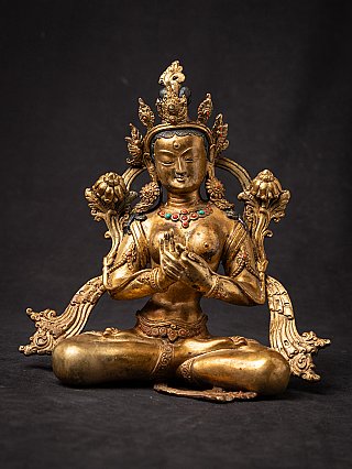 Tara statue from Nepal in gilded bronze, seated with dharmachakra mudra, front view