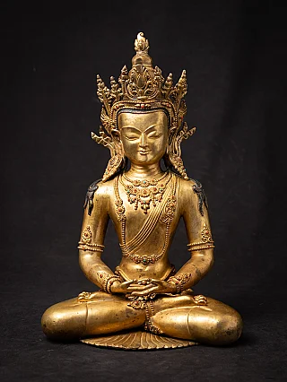 Nepali bronze Buddha statue seated in dhyana mudra, with ornate crown and inlaid jewellery