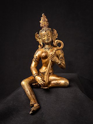Nepali Saraswati bronze statue seated with string instrument, full front view