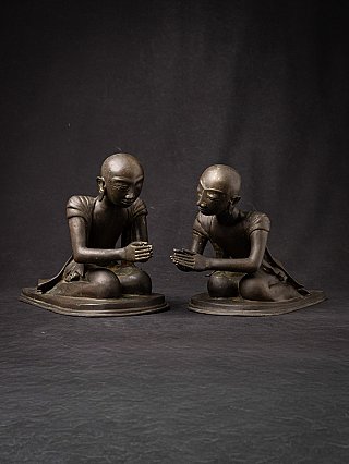 Pair of Burmese bronze monk statues seated with Namaskara mudra, angled front view
