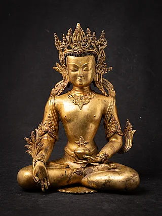 Medicine Buddha statue in bronze from Nepal, seated with crown and bowl, full-front view