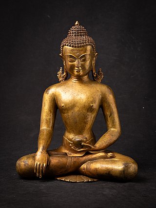Nepali bronze Buddha statue seated in bhumisparsha mudra, full front view