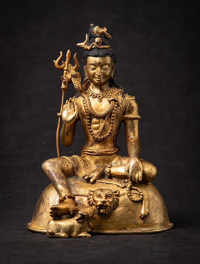Nepali bronze Shiva statue seated with raised hand in abhaya mudra, full front view