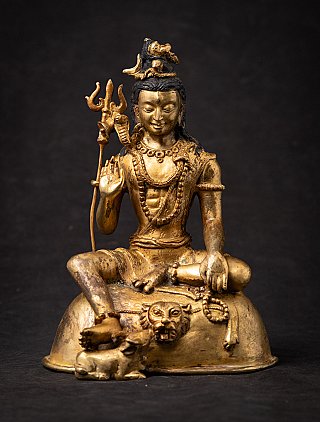 Nepali bronze Shiva statue seated with raised hand in abhaya mudra, full front view