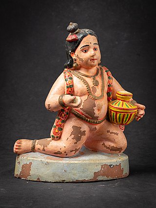 Krishna child statue in painted wood with pot, three-quarter right view