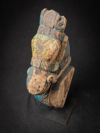 Antique wooden temple fragment of a Horse head