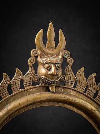Ancient Indian bronze Prabhavali temple arch with Kirtimukha