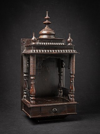 Antique Indian wooden temple shrine, three-quarter view with open niche and turned columns