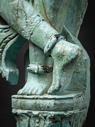 Antique wooden Indian statue of a mother figure with child