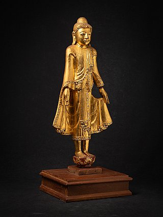 Beautiful antique wooden standing Mandalay Buddha