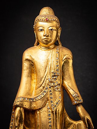 Beautiful antique wooden standing Mandalay Buddha