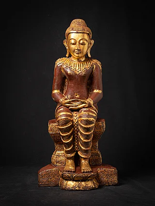 Old wooden Burmese Buddha statue