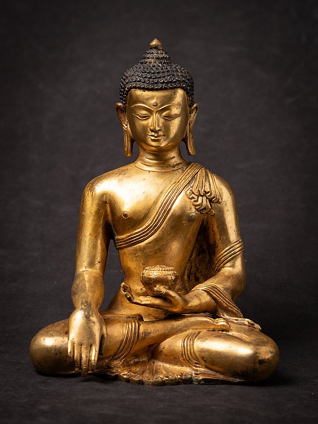 Old bronze Nepali Buddha statue