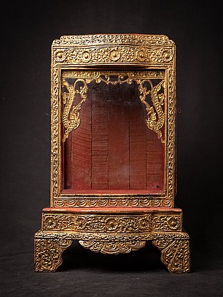 Antique wooden Burmese temple shrine, full front view with gilded frame and red interior