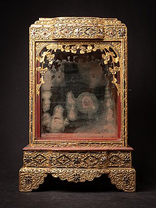 Antique Burmese wooden temple shrine with glass front panel and gilded ornament, front view