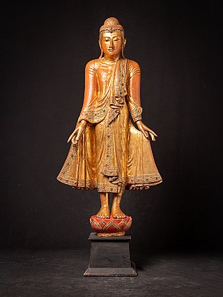 Antique wooden standing Mandalay Buddha