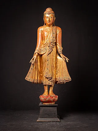 Antique wooden standing Mandalay Buddha