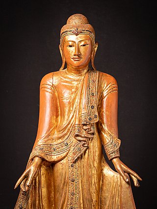 Antique wooden standing Mandalay Buddha