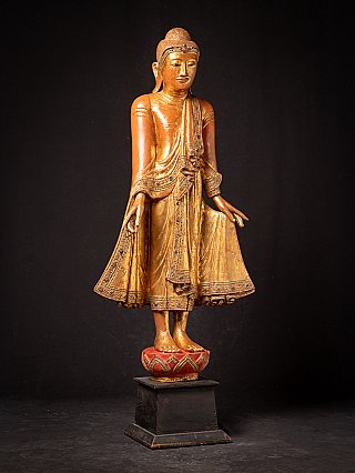 Antique wooden standing Mandalay Buddha
