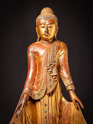 Antique wooden standing Mandalay Buddha