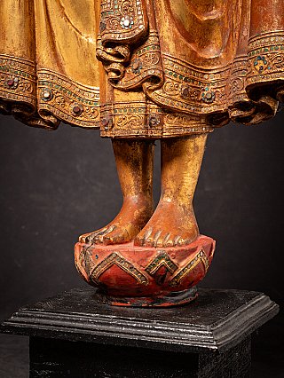 Antique wooden standing Mandalay Buddha
